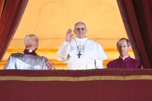 Pope Franics waves at balcony
