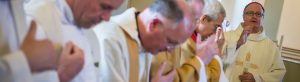 Priests making the Sign of the Cross